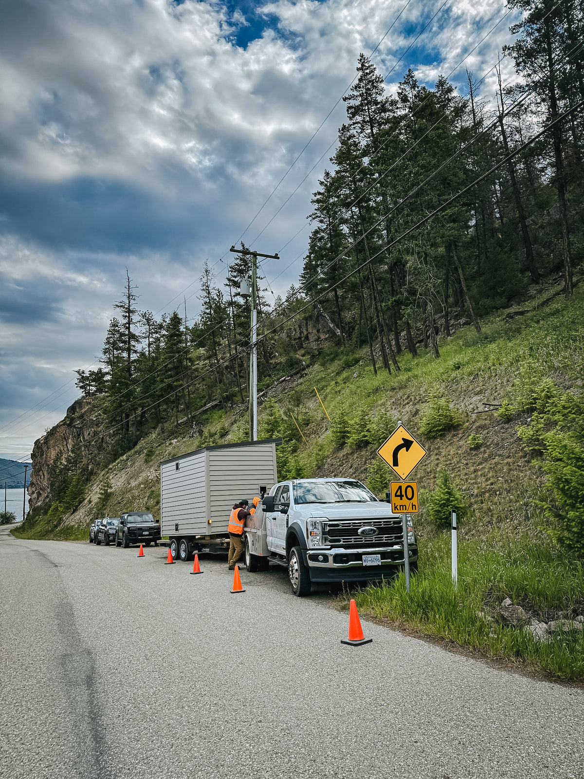 Delivery truck and sauna on a lakeshore road near Okanagan Lake