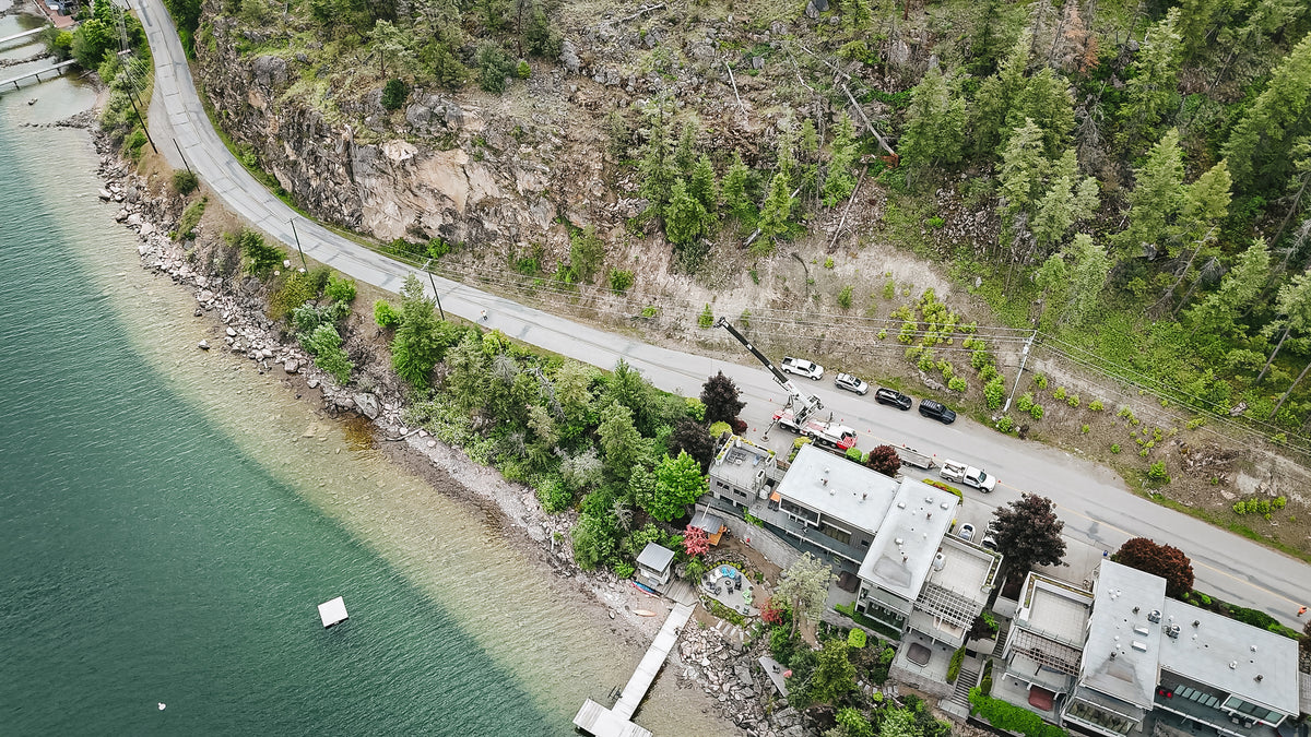 Aerial of a waterfront property on the north end of Okanagan Lake with dock and installed sauna