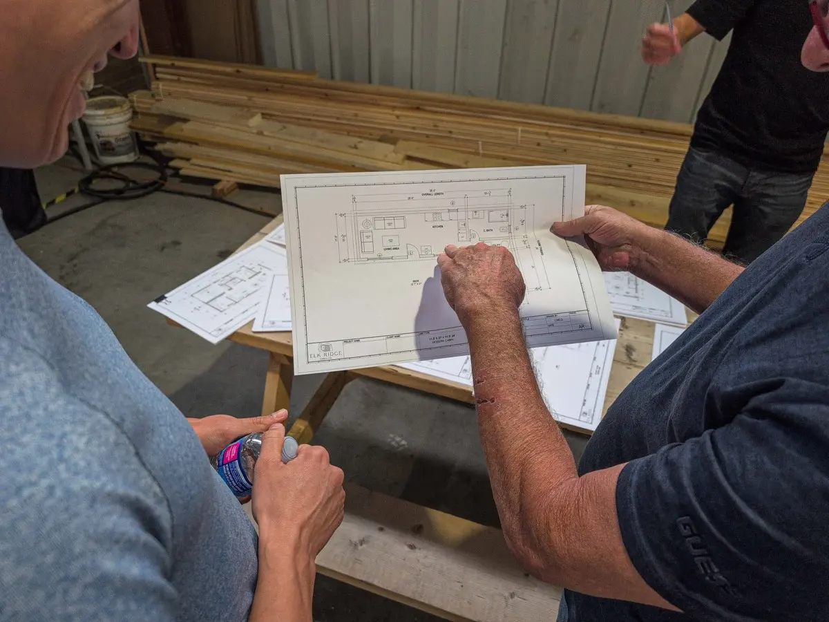 Clients going over their floor plan with the Elk Ridge team in the shop
