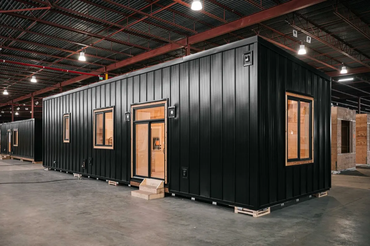 Finished module with black standing seam siding inside the Elk Ridge shop